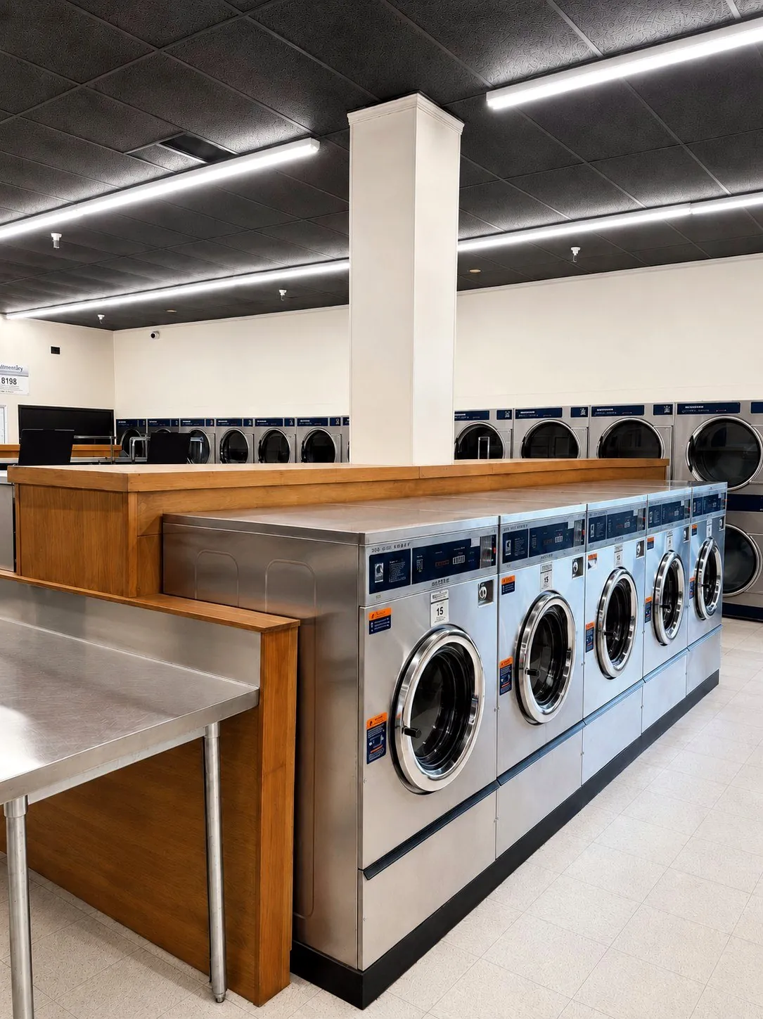 Large-capacity stainless steel washers inside Bennett Valley Laundromat