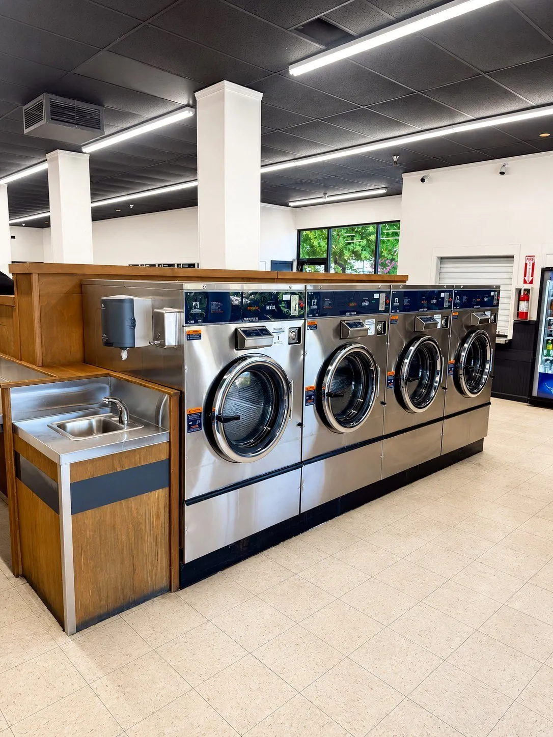 Front row of large-capacity washers at Bennett Valley Laundromat