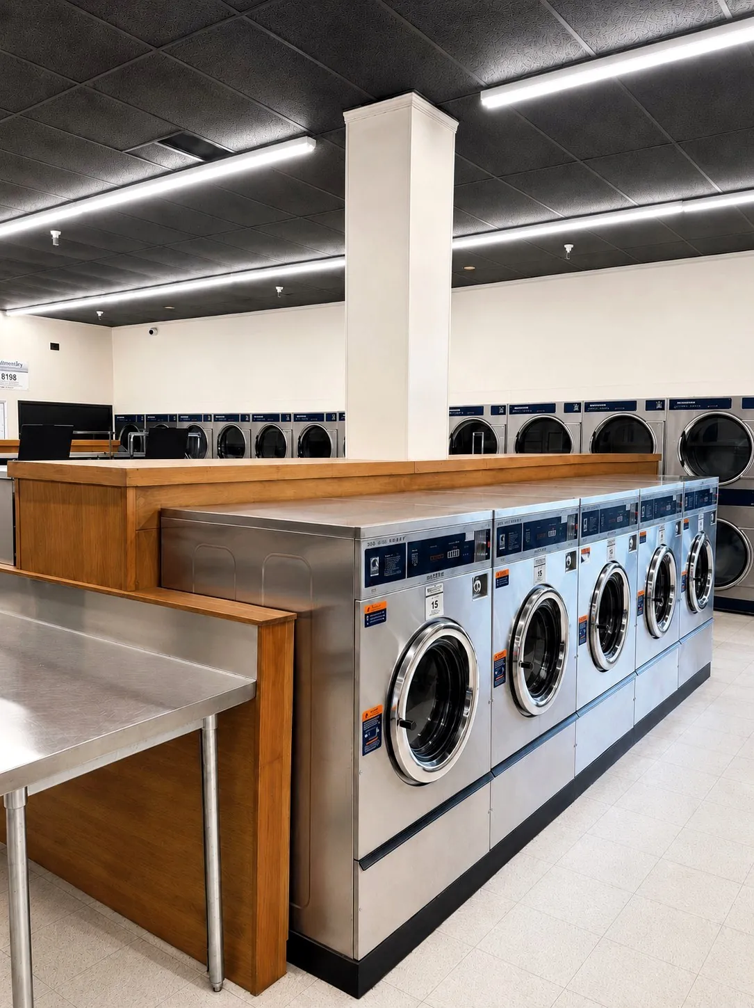 Row of clean large-capacity washers inside Bennett Valley Laundromat