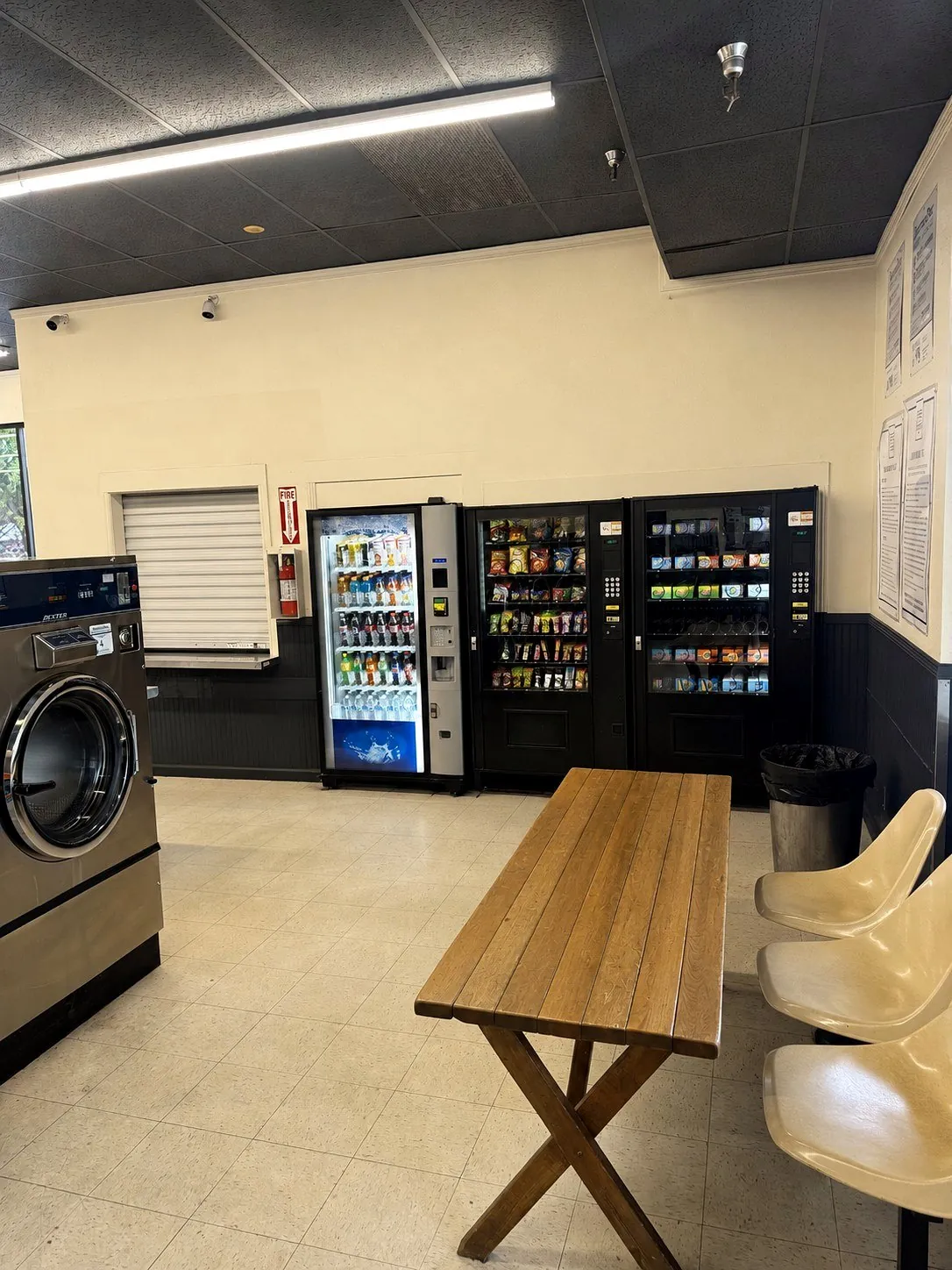 Vending machines, seating, and laundry supply area at Bennett Valley Laundromat
